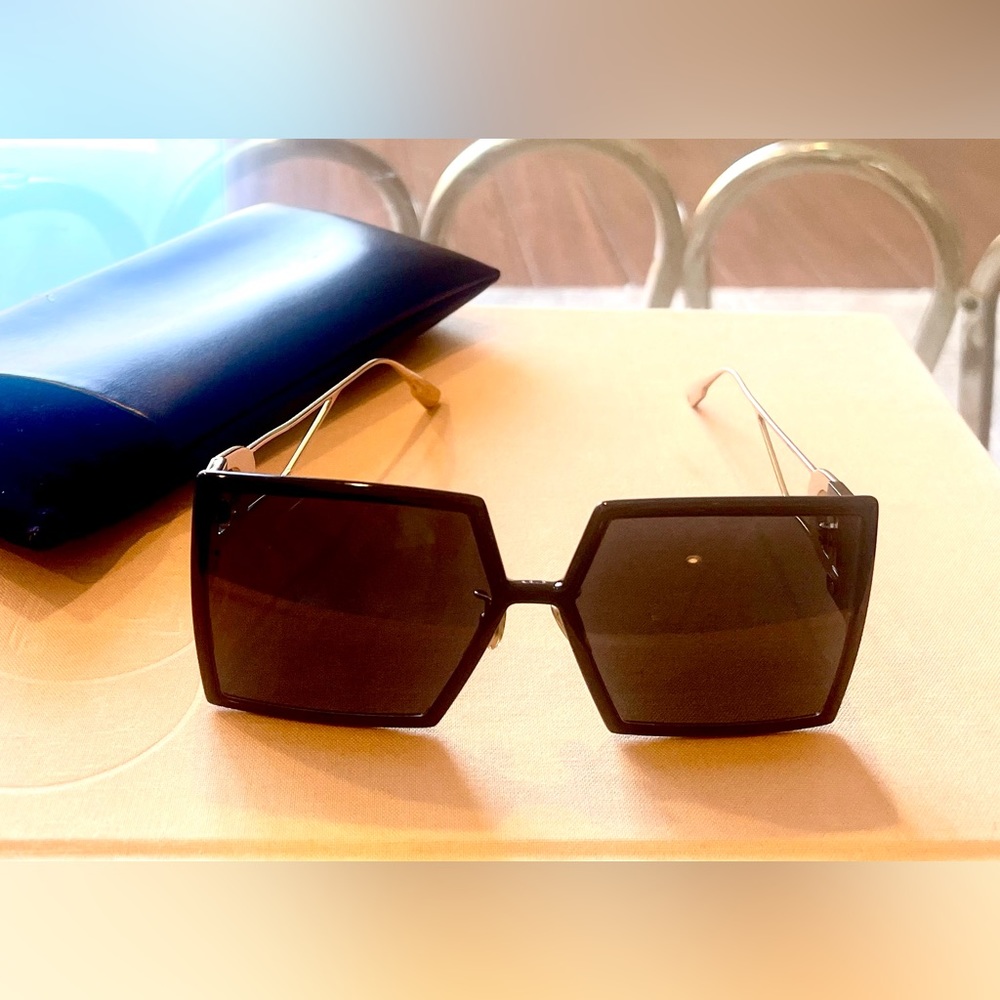 A  beautiful black and gold Dior sunglass.
